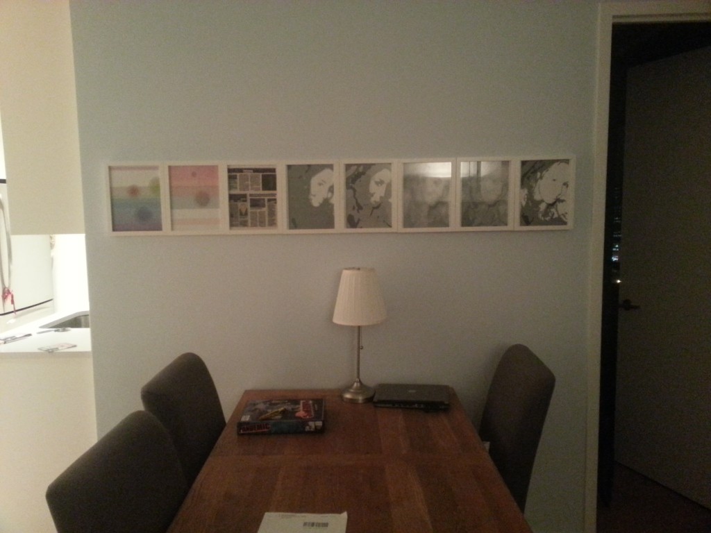 8 white frames over my dining table